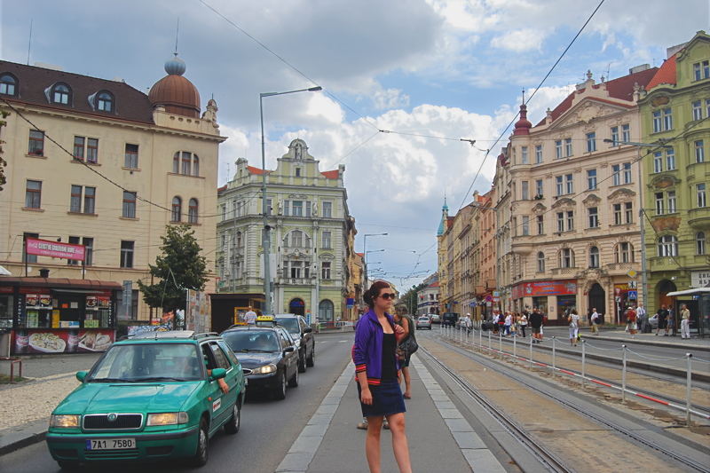 16 - A classic urban view with European architecture, tram tracks embedded in the asphalt, and local city traffic in the Nusle district of Prague